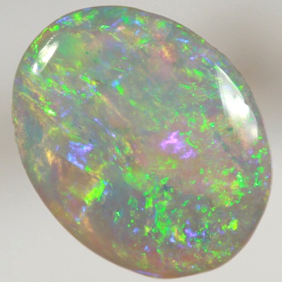 SOLID CRYSTAL OPAL Bright sparkles of greens throughout a purple hue